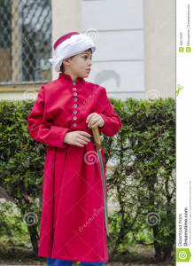 http://www.dreamstime.com/royalty-free-stock-photo-boy-janissary-side-profile-dressed-as-ottoman-red-tunic-turban-may-bucharest-image40673425